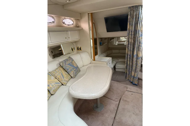Slide: The Image of Interior of 1997 Sea Ray Sundancer 370 yacht with plush seating and elegant decor. - 17