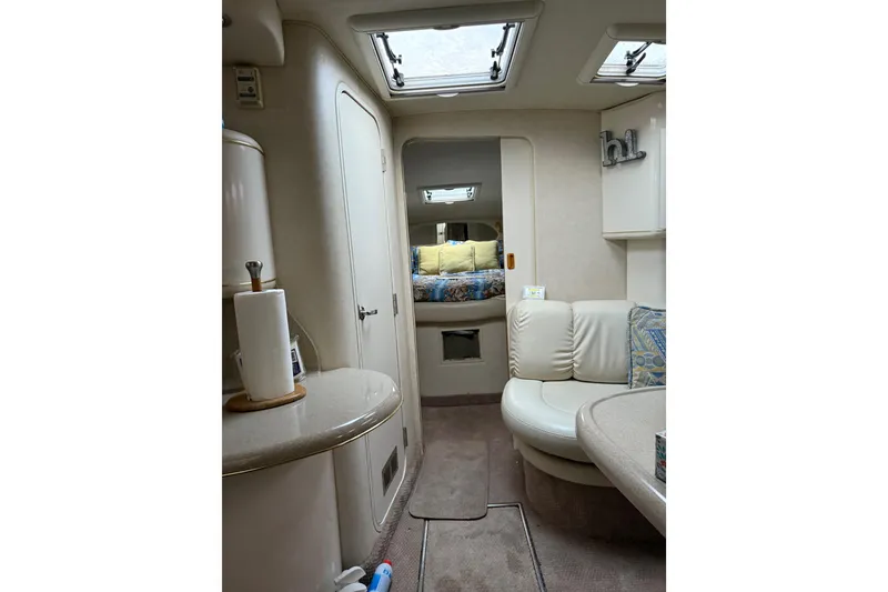 Slide: The Image of Interior of 1997 Sea Ray Sundancer 370 yacht, featuring cozy seating and modern amenities. - 20