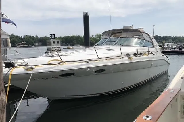 Slide: The Image of 1997 Sea Ray Sundancer 370 yacht docked at marina, side view. - 6