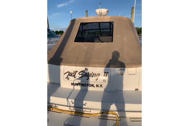 Slide: The Image of 1997 Sea Ray Sundancer 370 yacht docked in Huntington, N.Y., with beige cover. - 7