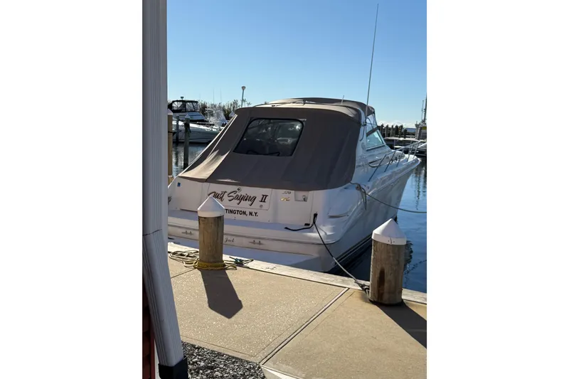 Slide: The Image of 1997 Sea Ray Sundancer 370 docked at marina, rear view with cover. - 9