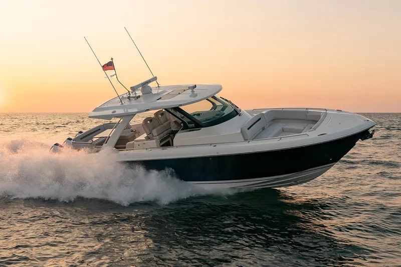 Slide: The Image of Manufacturer Provided Image: 2025 Tiara Yachts 38 LS cruising at sunset on open water. - 10