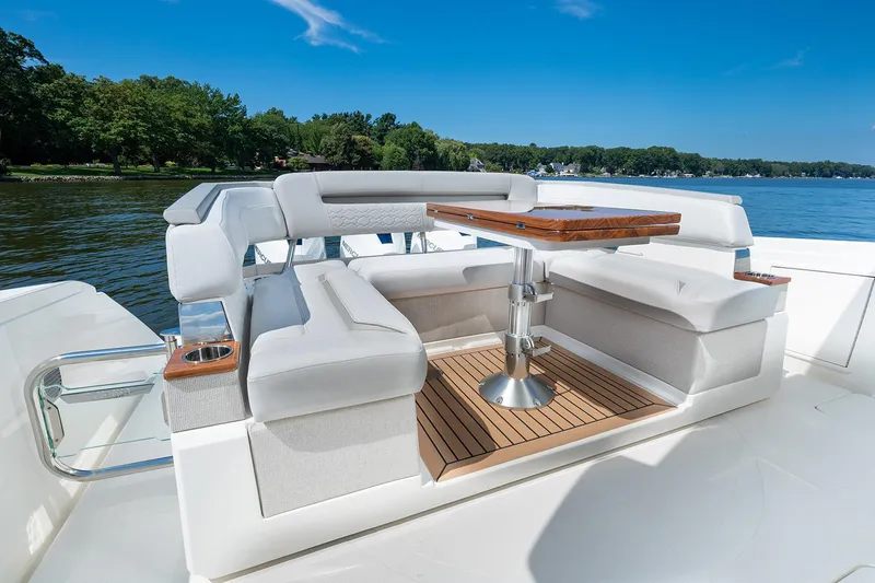 Slide: The Image of Manufacturer Provided Image: 2025 Tiara Yachts 38 LS luxury seating area with table on a sunny day. - 21
