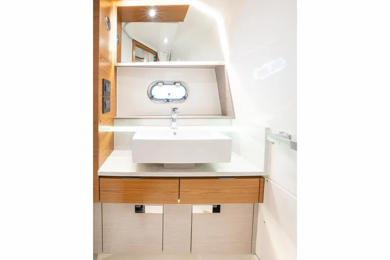 Slide: The Image of Manufacturer Provided Image: Luxurious bathroom interior of 2025 Tiara Yachts 38 LS, featuring modern sink and wooden accents. - 24