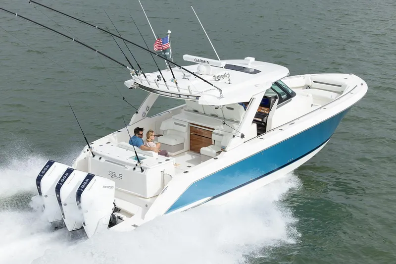 Slide: The Image of Manufacturer Provided Image: 2025 Tiara Yachts 38 LS cruising on water, featuring sleek design and powerful engines. - 4