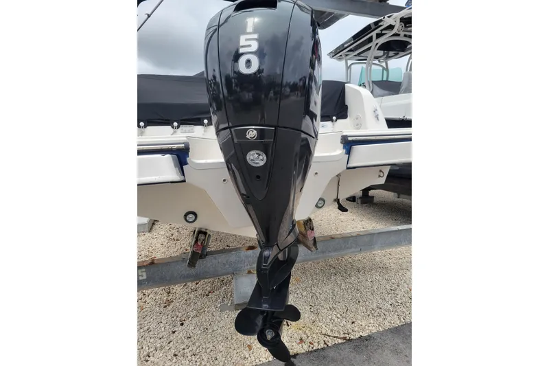 Slide: The Image of 2023 Bayliner DX 2200 boat with a 150 HP outboard motor. - 3