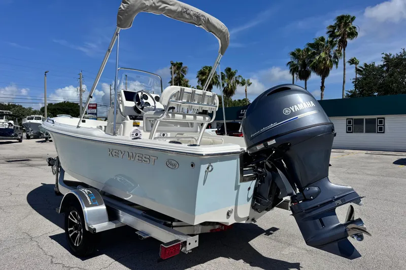 Slide: The Image of 2026 Key West 1720 Center Console boat with Yamaha outboard motor on trailer. - 11