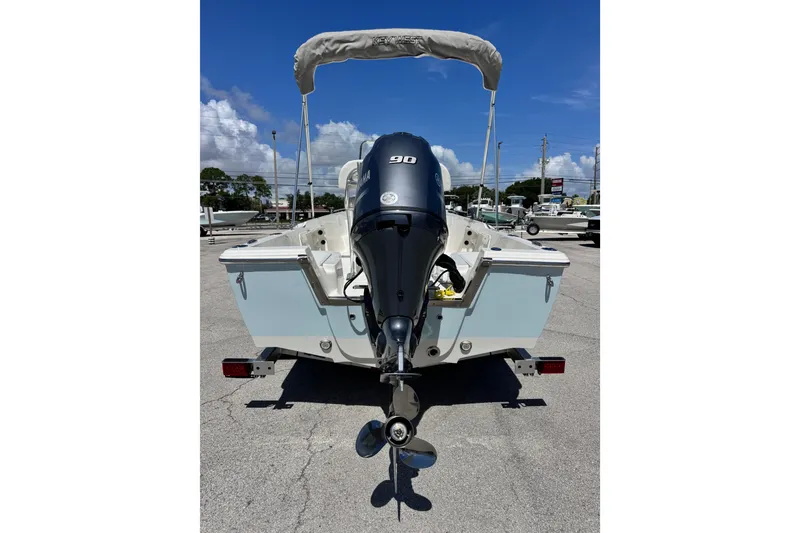 Slide: The Image of 2026 Key West 1720 Center Console boat with Yamaha outboard motor, parked on a trailer. - 12