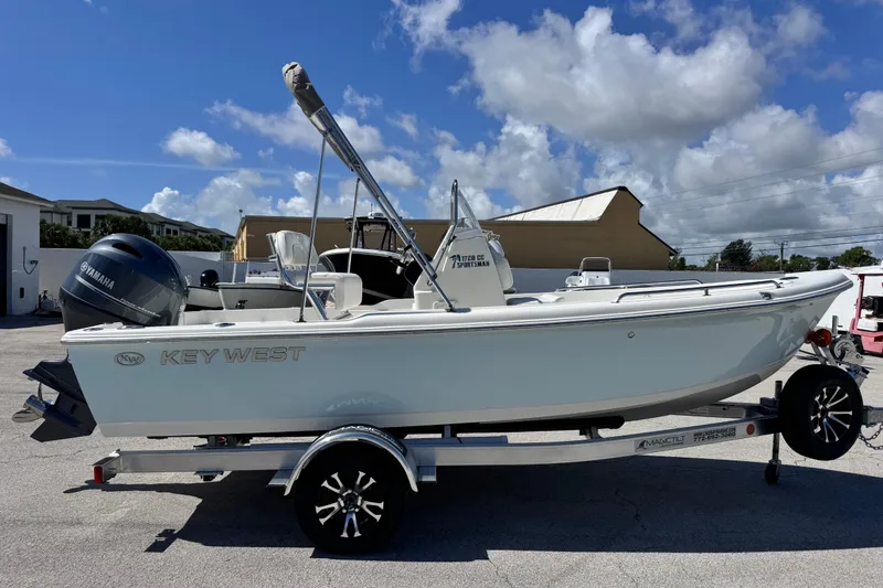 Slide: The Image of 2026 Key West 1720 Center Console boat on trailer under clear blue sky. - 14