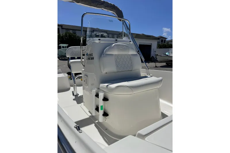Slide: The Image of 2026 Key West 1720 Center Console boat interior with seating and console view. - 17