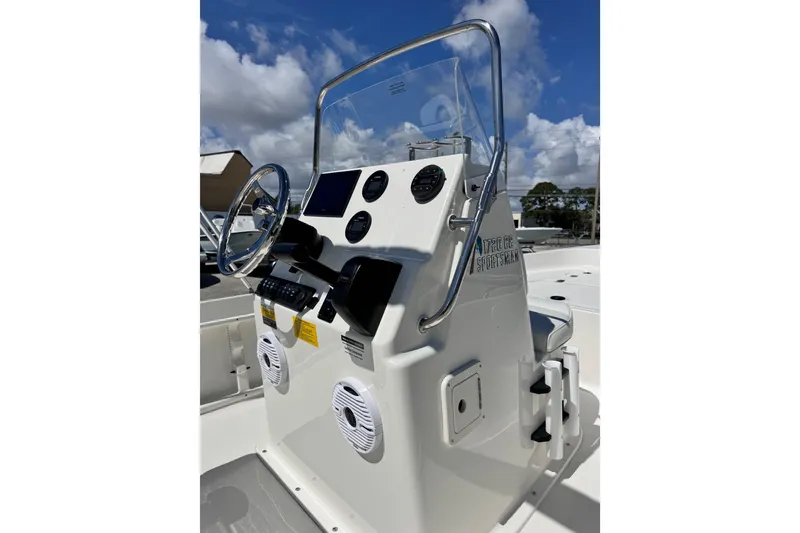 Slide: The Image of 2026 Key West 1720 Center Console boat dashboard with steering wheel and controls. - 18