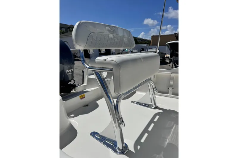 Slide: The Image of 2026 Key West 1720 Center Console boat seat with chrome frame under clear blue sky. - 19