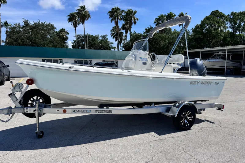 The Image of 2026 Key West 1720 Center Console boat on trailer, parked outdoors under clear sky. - 8