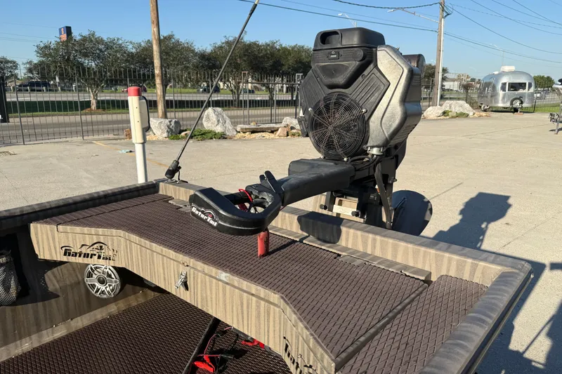 Slide: The Image of 2023 Gator Tail 1852 boat with powerful engine, parked outdoors on a sunny day. - 8