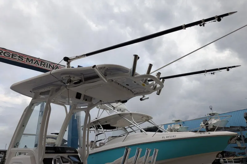 Slide: The Image of 2020 Everglades 243 Center Console boat with fishing rods at marina. - 11