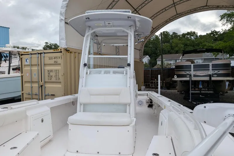 Slide: The Image of 2020 Everglades 243 Center Console boat under canopy, showcasing seating and console. - 7
