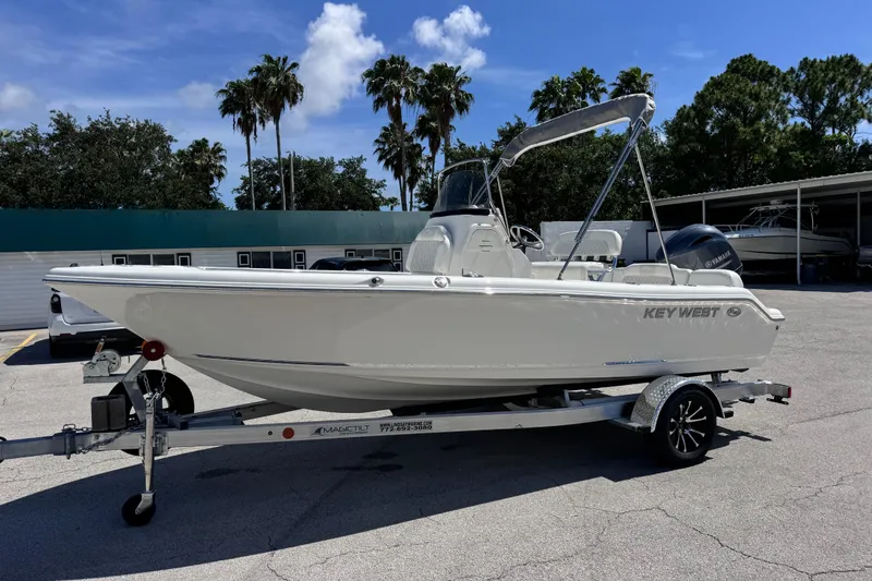 The Image of 2026 Key West 189 FS boat on trailer, parked outdoors under clear sky. - 12