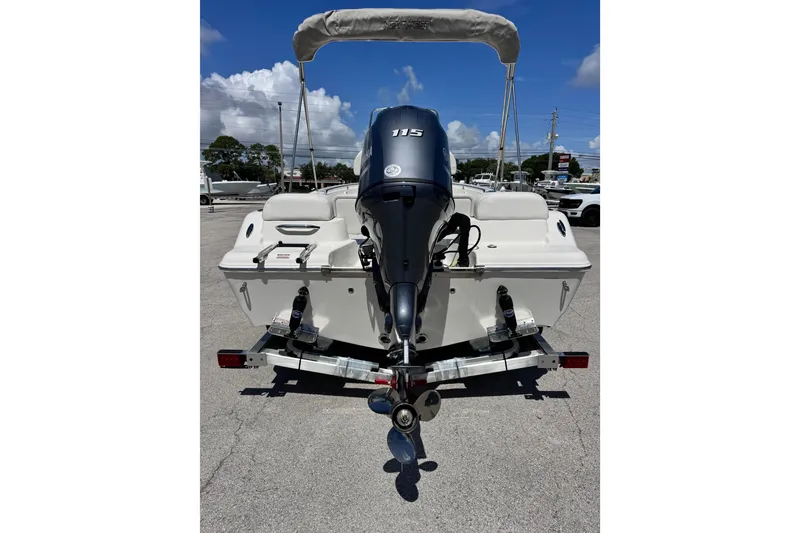 Slide: The Image of 2026 Key West 189 FS boat with outboard motor, parked on a trailer. - 15