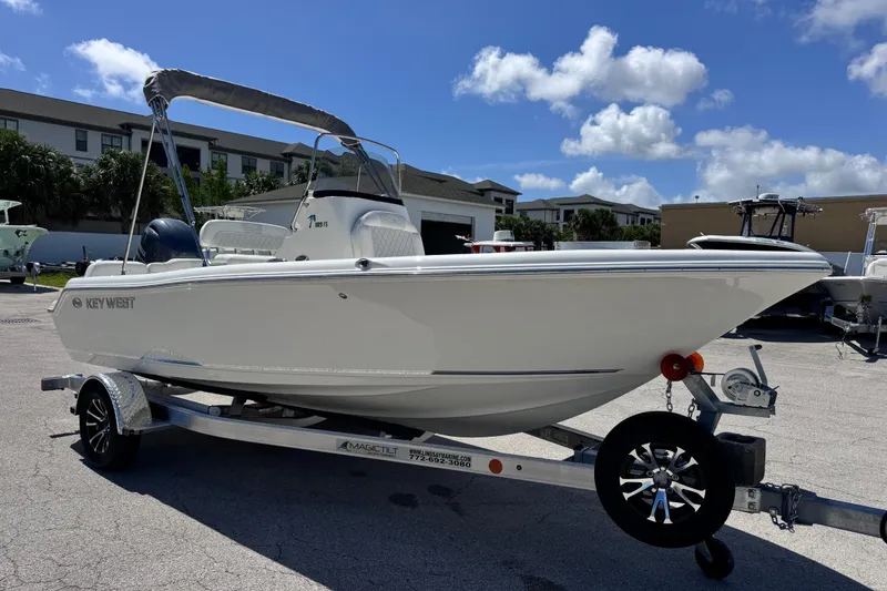 Slide: The Image of 2026 Key West 189 FS boat on trailer under clear blue sky. - 18