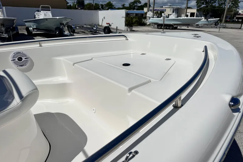Slide: The Image of 2026 Key West 189 FS boat interior with seating and storage compartments. - 19