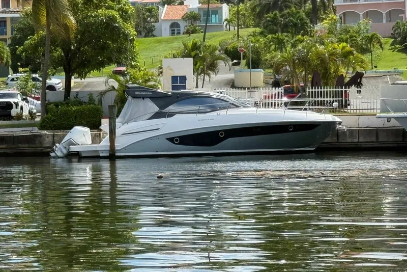 The Image of 2023 Schaefer 400 Sport yacht docked in a scenic marina setting. - 0