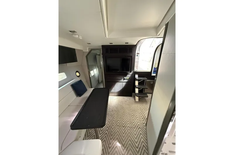 Slide: The Image of Interior of 2023 Schaefer 400 Sport yacht with modern design and cozy seating area. - 10