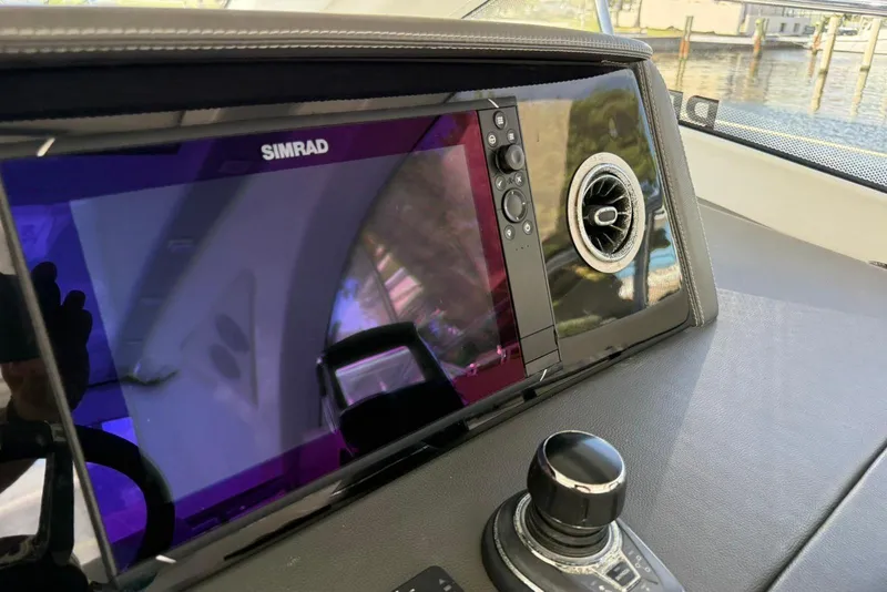 Slide: The Image of Dashboard of 2023 Schaefer 400 Sport with Simrad display and control knob. - 16