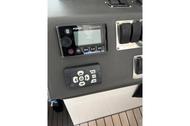 Slide: The Image of Control panel of 2023 Schaefer 400 Sport boat with Fusion MS-NRX300 audio system. - 3