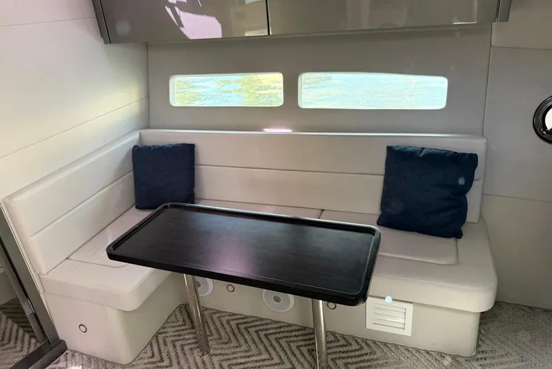 Slide: The Image of Modern interior of 2023 Schaefer 400 Sport yacht with sleek seating and table. - 7