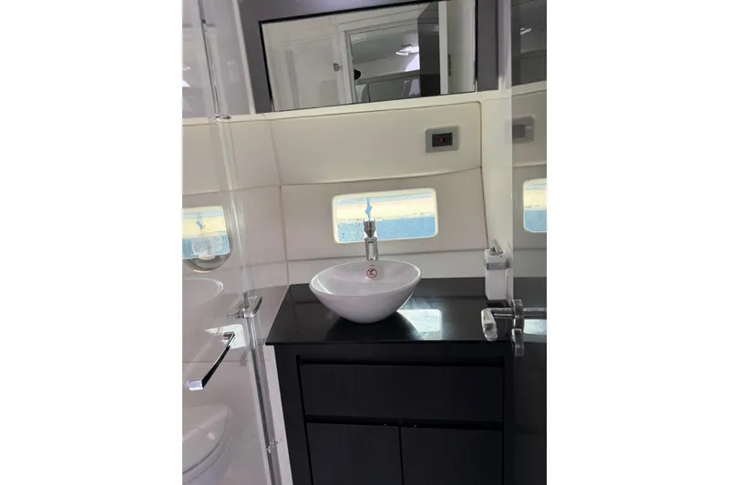 Slide: The Image of Modern bathroom interior of 2023 Schaefer 400 Sport yacht with sleek sink design. - 9