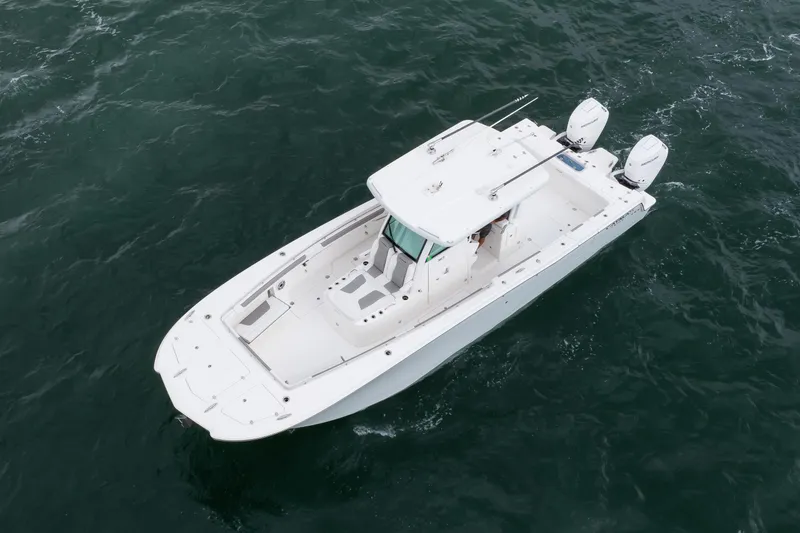 Slide: The Image of 2024 Caymas 341 CC boat cruising on open water, aerial view. - 15