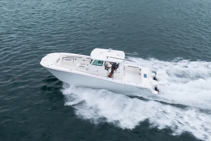 Slide: The Image of 2024 Caymas 341 CC boat cruising on open water, showcasing sleek design and powerful performance. - 20