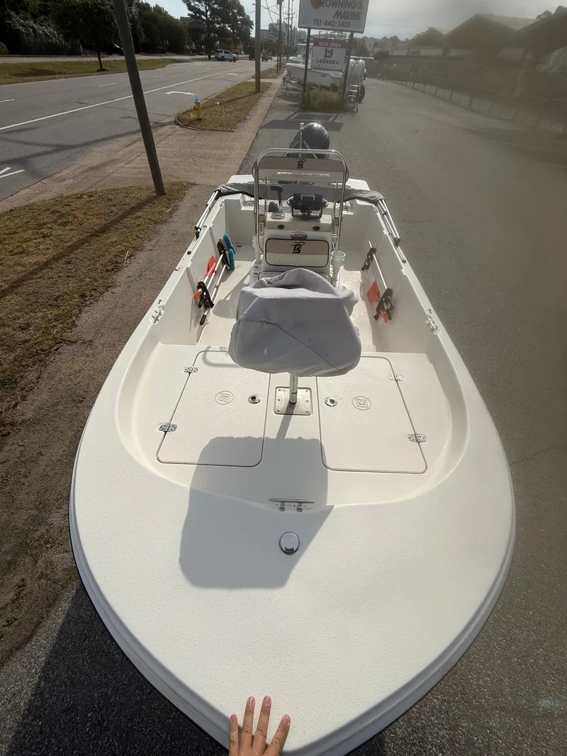 Slide: The Image of 2020 Carolina Skiff 17 JLS boat parked on roadside. - 3