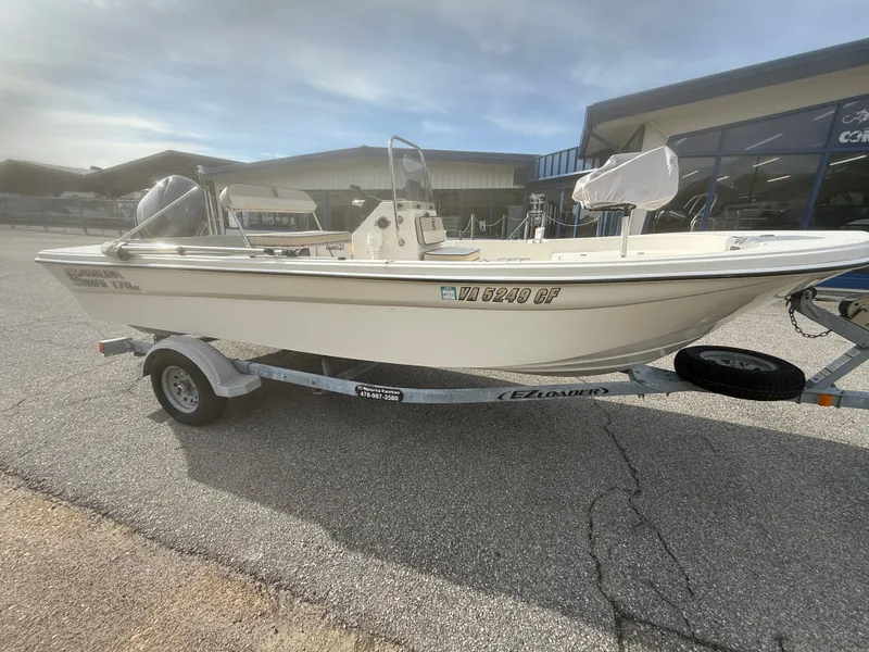 Slide: The Image of 2020 Carolina Skiff 17 JLS boat on trailer outside a building. - 5