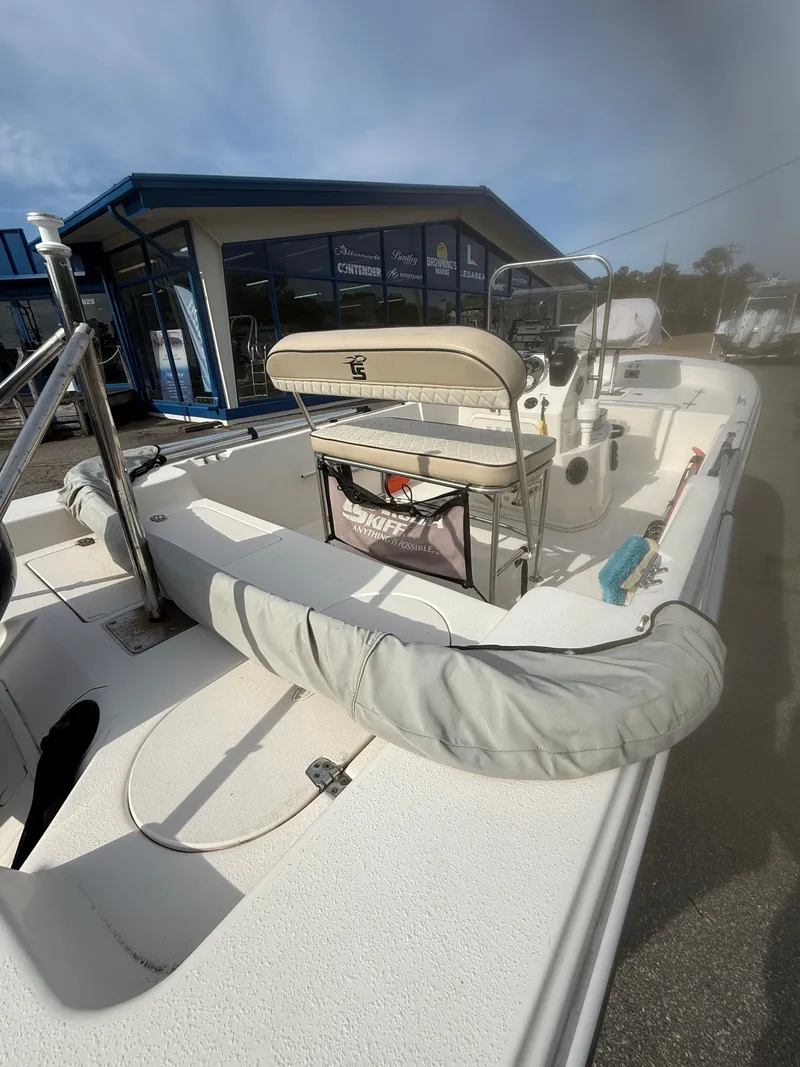 Slide: The Image of 2020 Carolina Skiff 17 JLS boat parked outside building. - 6