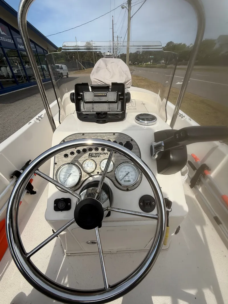 Slide: The Image of Steering console of a 2020 Carolina Skiff 17 JLS boat. - 9