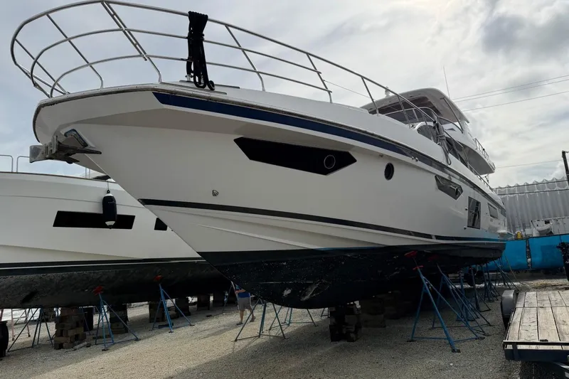 Slide: The Image of 2017 Azimut Fly 72 yacht on stands, viewed from the front in a boatyard. - 2