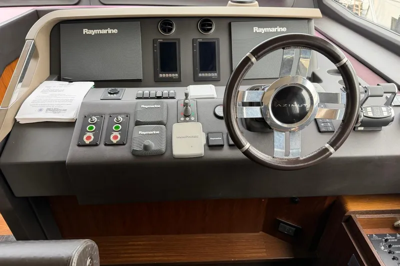 Slide: The Image of Cockpit of 2017 Azimut Fly 72 yacht with Raymarine navigation equipment and steering wheel. - 22