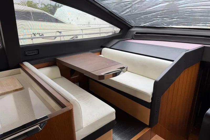 Slide: The Image of Luxurious interior of 2017 Azimut Fly 72 yacht with elegant seating and wooden table. - 23