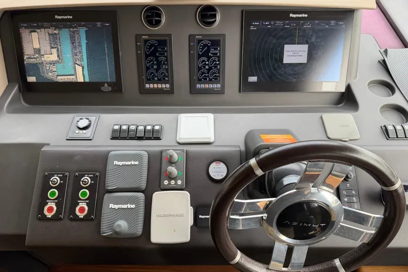 Slide: The Image of Cockpit of 2017 Azimut Fly 72 yacht with navigation screens and steering wheel. - 29