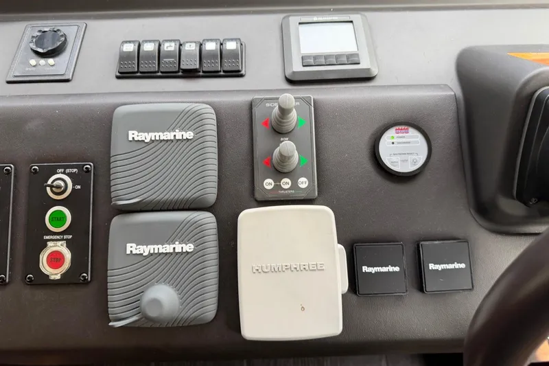 Slide: The Image of Control panel of a 2017 Azimut Fly 72 yacht featuring Raymarine equipment. - 33