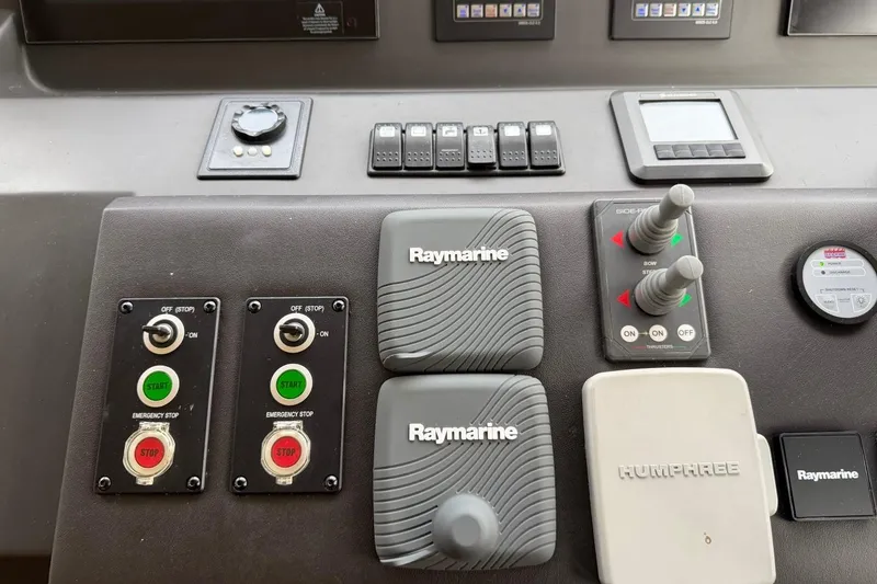Slide: The Image of Control panel of a 2017 Azimut Fly 72 yacht featuring Raymarine and Humphree systems. - 34