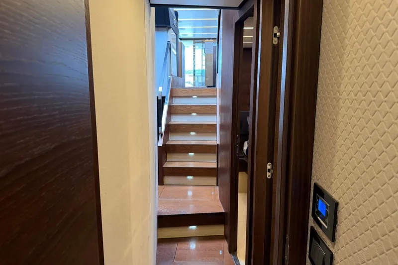 Slide: The Image of Interior view of 2017 Azimut Fly 72 yacht with illuminated wooden staircase. - 37