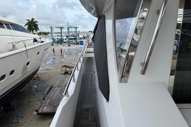 Slide: The Image of Azimut Fly 72 yacht, 2017 model, docked at a marina with maintenance equipment nearby. - 4