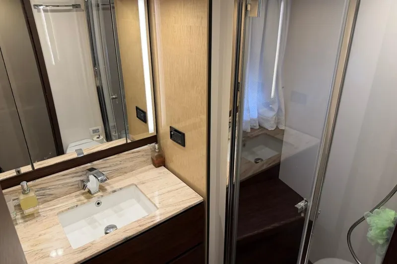 Slide: The Image of Luxurious bathroom interior of 2017 Azimut Fly 72 yacht with modern fixtures and elegant design. - 46