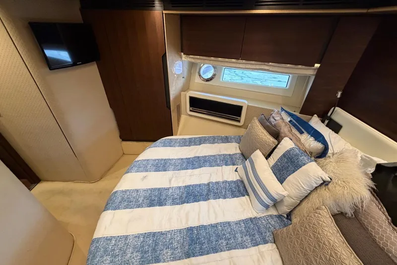 Slide: The Image of Luxurious bedroom interior of 2017 Azimut Fly 72 yacht with striped bedding and modern decor. - 49