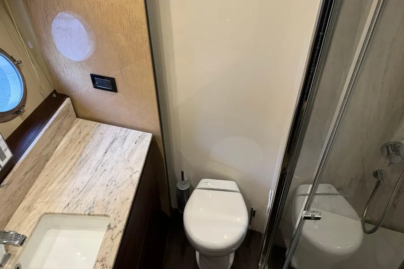 Slide: The Image of Luxurious bathroom in 2017 Azimut Fly 72 yacht with marble countertop and modern fixtures. - 50