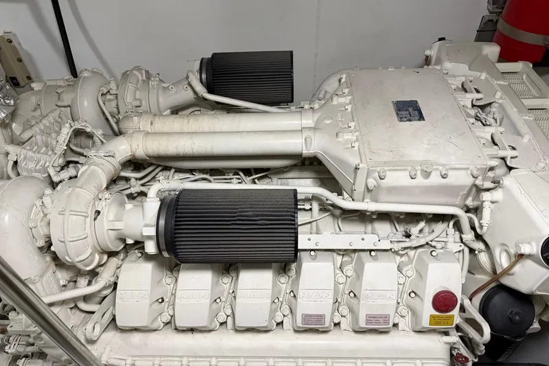 Slide: The Image of Engine of a 2017 Azimut Fly 72 yacht, showcasing intricate mechanical components. - 54