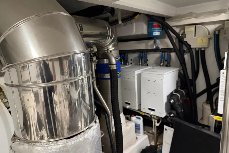 Slide: The Image of Engine room of 2017 Azimut Fly 72 yacht with mechanical components and piping. - 56