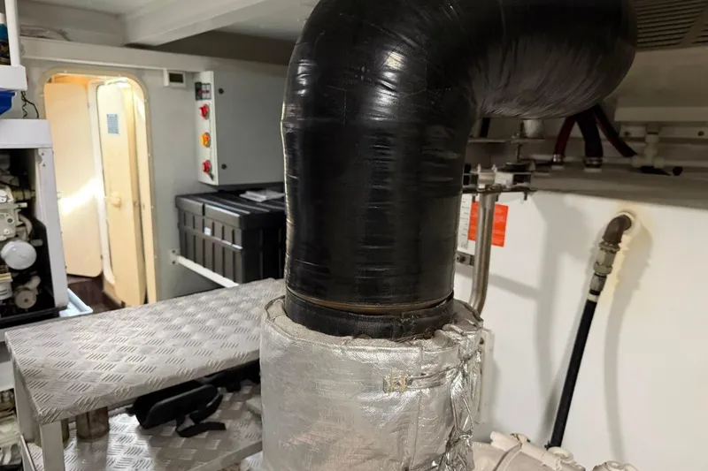 Slide: The Image of Engine room of 2017 Azimut Fly 72 yacht with visible exhaust pipe. - 57